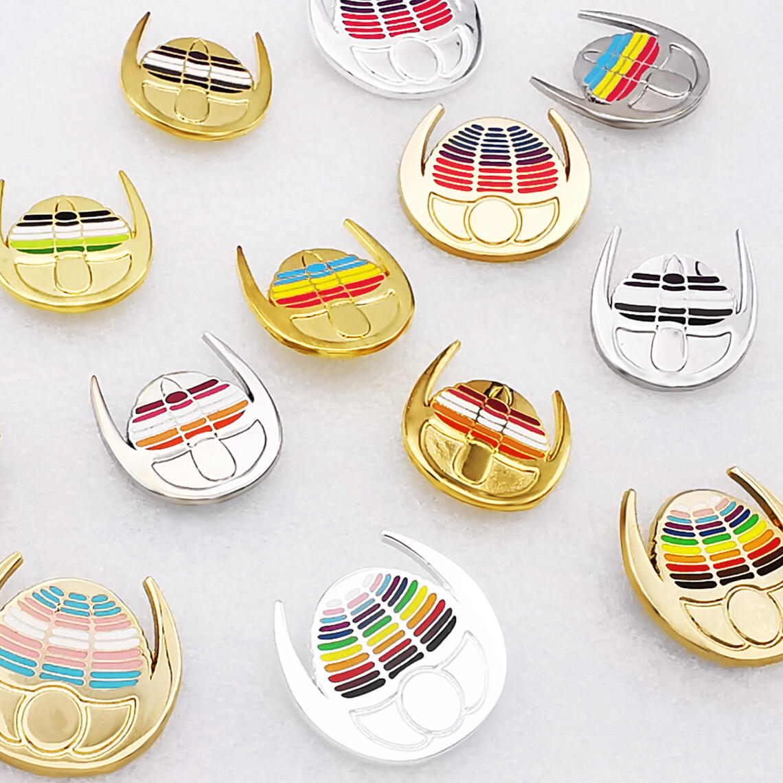 Trilobite enamel pins featuring LGBT+ pride flags