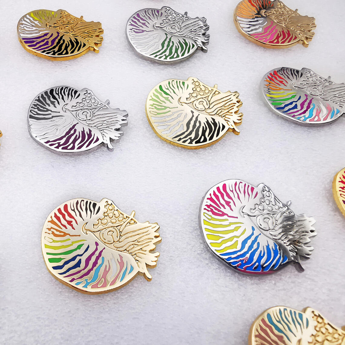 Nautilus pompilius Ammonite enamel pins featuring LGBT+ pride flags