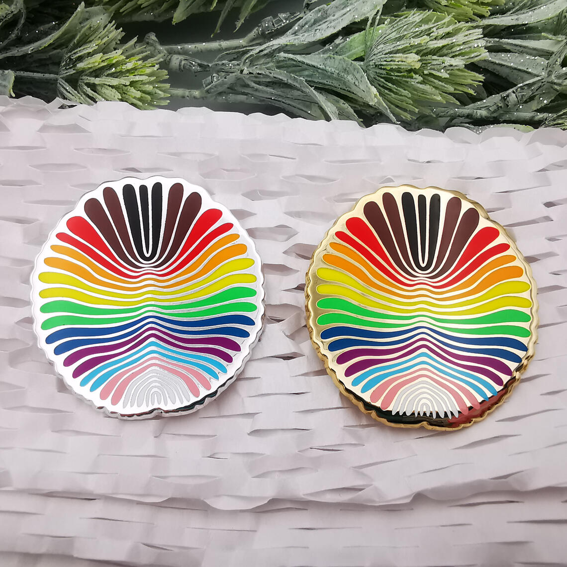 Dickinsonia enamel pins featuring LGBT+ Progress Pride Flag.