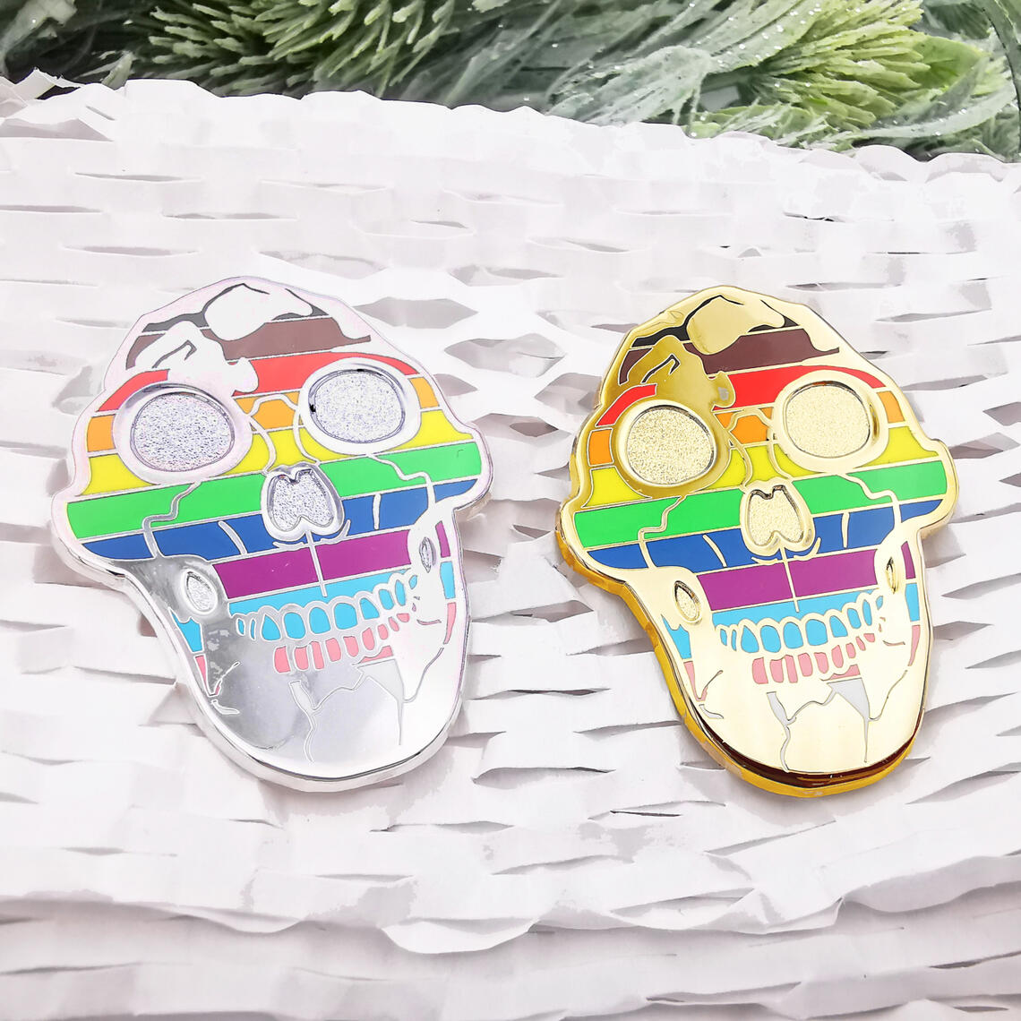 Lucy the Australopithecus enamel pins featuring LGBT+ Progress Pride Flag.